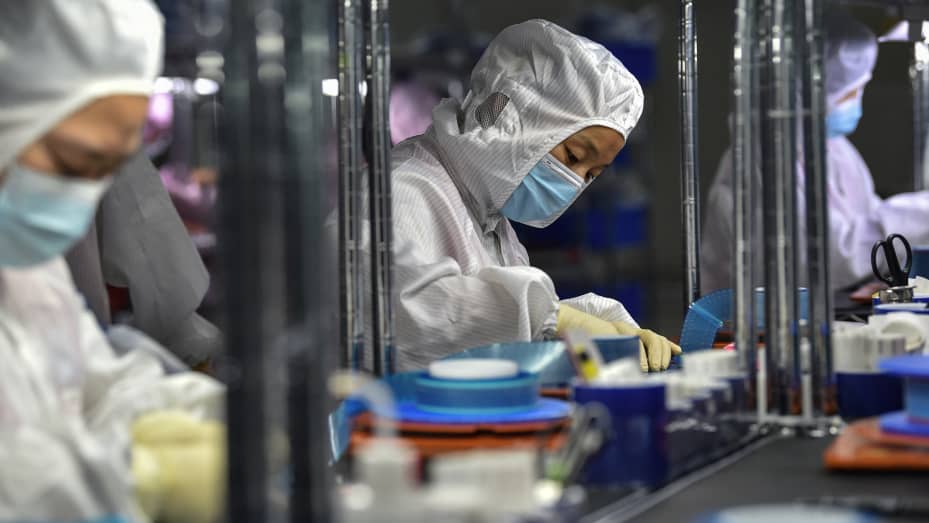 Cybercab Robotaxi Some Apple, Tesla suppliers suspend production in China amid power pinch 28-1632701320216-gettyimages-1235264568-AFP_9MV6WK